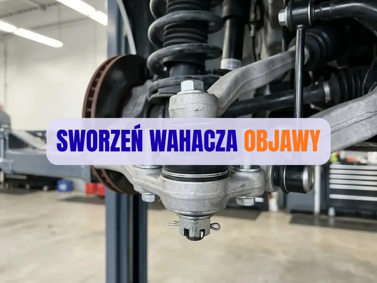 Widok na uszkodzony sworzeń wahacza i jego objawy.